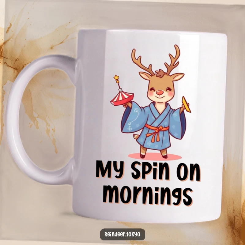 Funny mug showcasing a smiling reindeer in a blue kimono, skillfully twirling a colorful spinning top, embodying playful concentration.