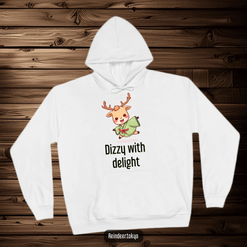 Funny hoodie featuring a cheerful reindeer in a green kimono, spinning joyfully with a delighted expression, perfect for cozy, humorous moments.