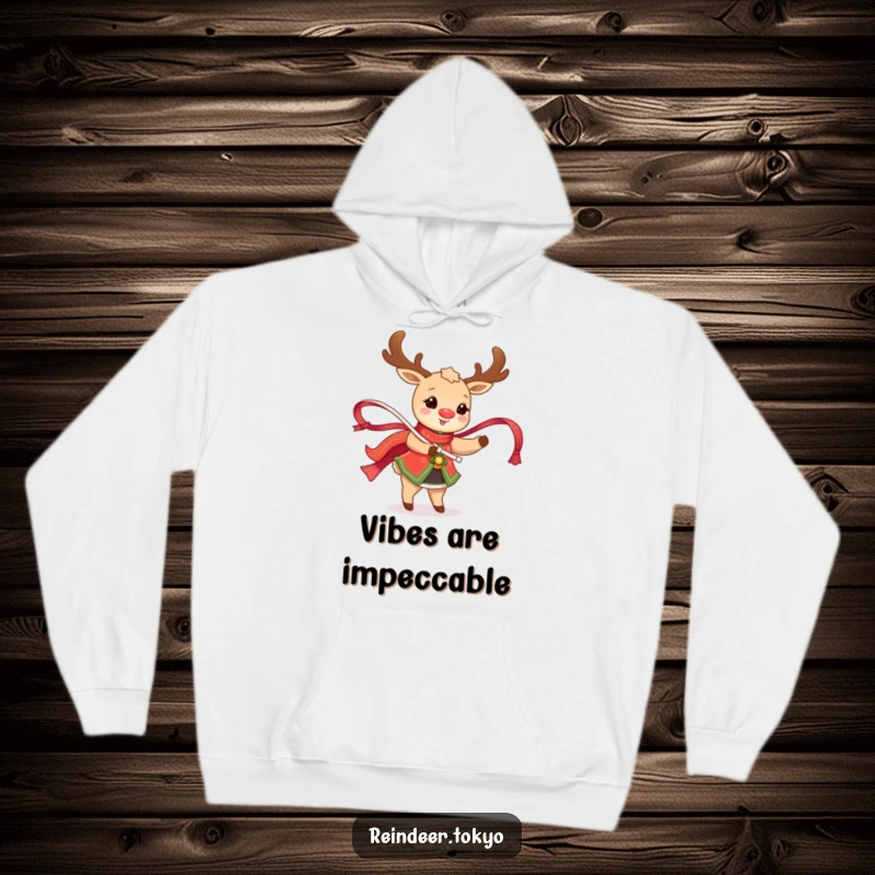Funny Reindeer Hoodie: Happy reindeer in traditional attire twirls a shimmering ribbon, radiating festive joy.