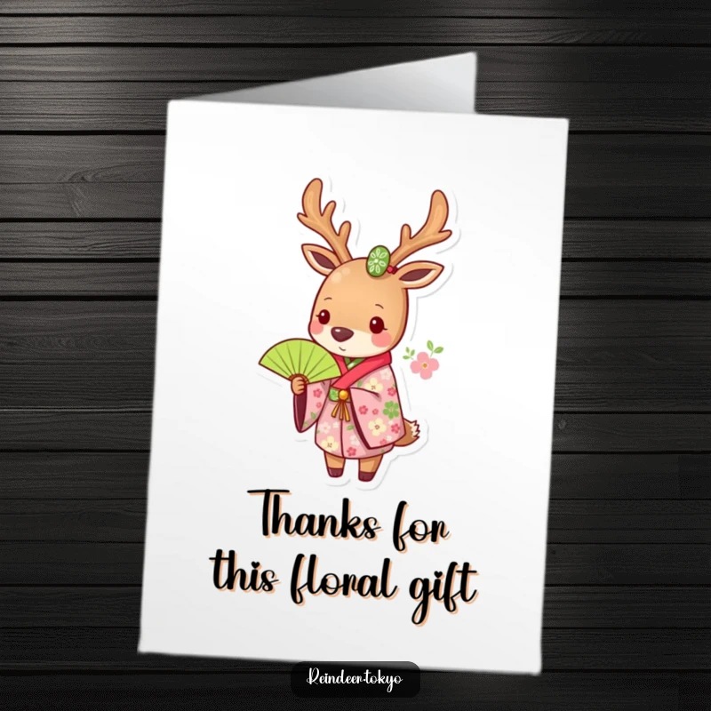 Funny free printable thank you card: a reindeer in a floral kimono holds a green fan with charm.