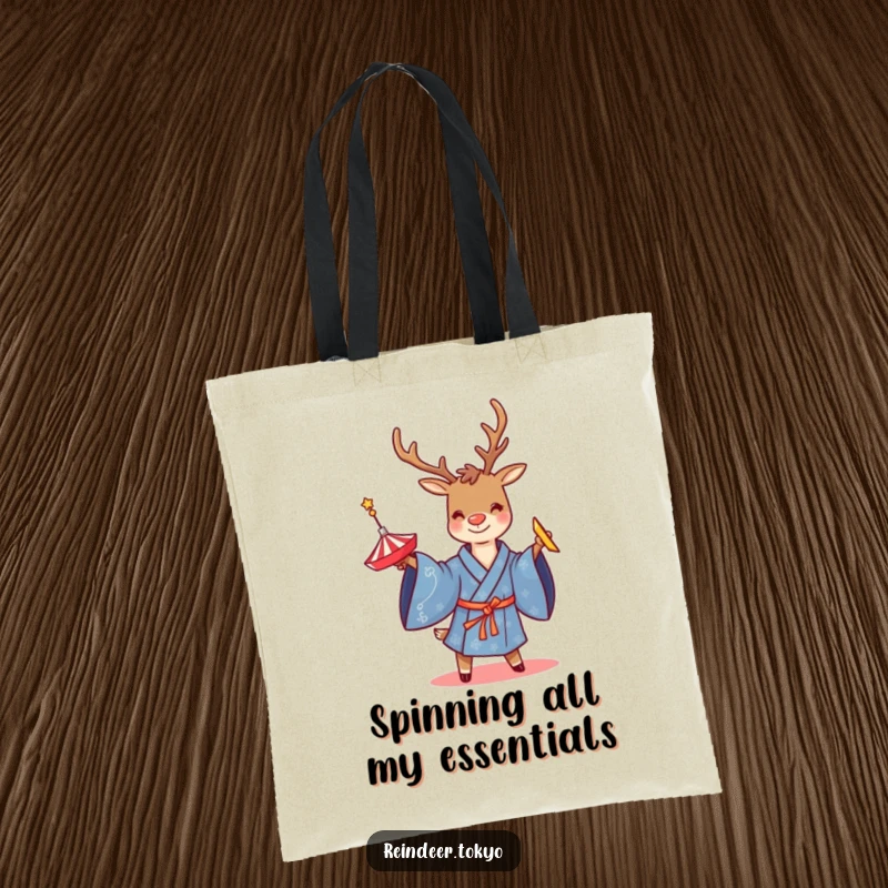 Funny tote bag featuring a smiling reindeer in a blue kimono, twirling a spinning top, perfect for carrying daily items with flair.